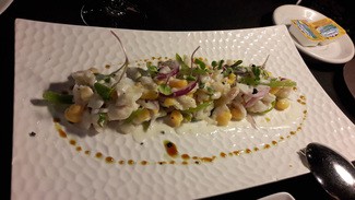 Ceviche de corvina marinada en leche de tigre con millo de la isla