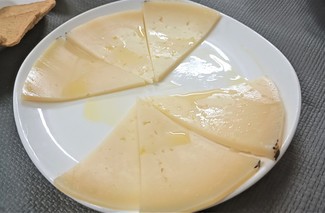 Con el manchego curadito