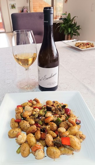 Con un salteado de vieiras y papas chaucha