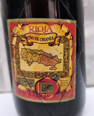 "CRIANZA", 4-5 años de barrica y 3 en botella ):